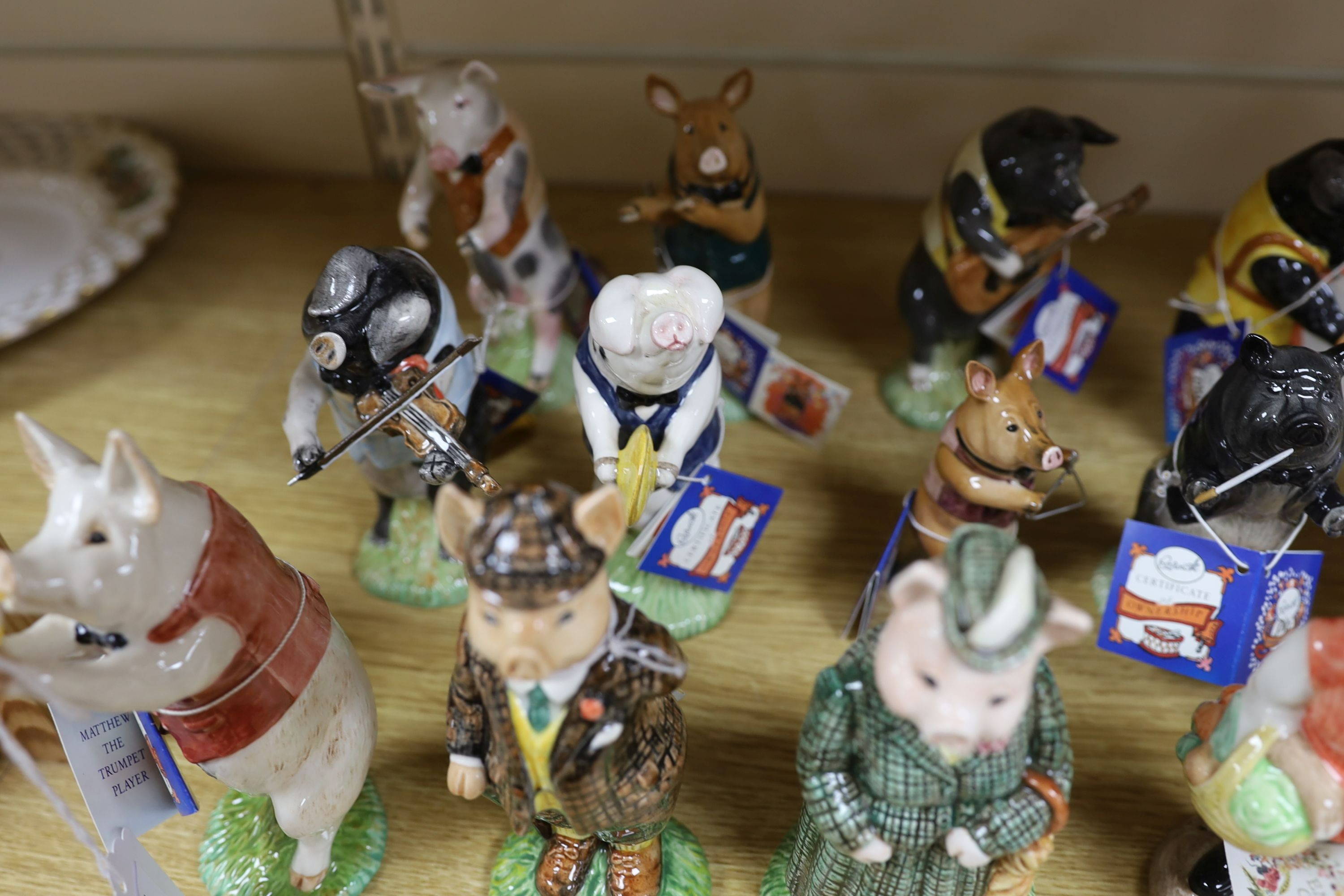 Eighteen Beswick figures, to include the Pig Promenade (10), and English Country Folk (8)